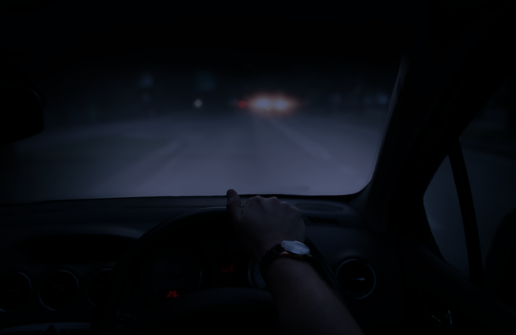 Sutton Coldfield private investigator driving a car at night