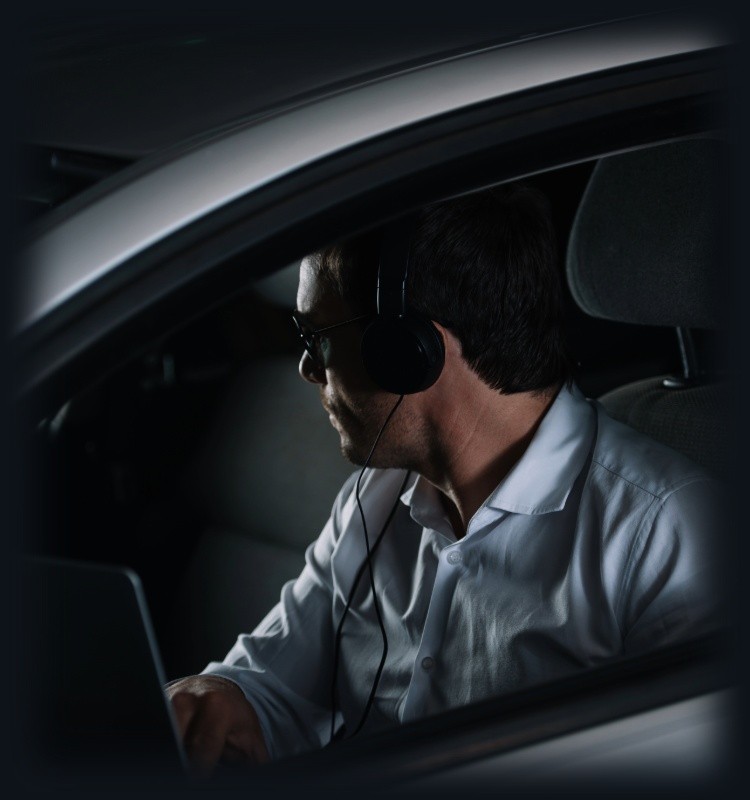 a private investigator in Sutton Coldfield performing covert surveillance from a car