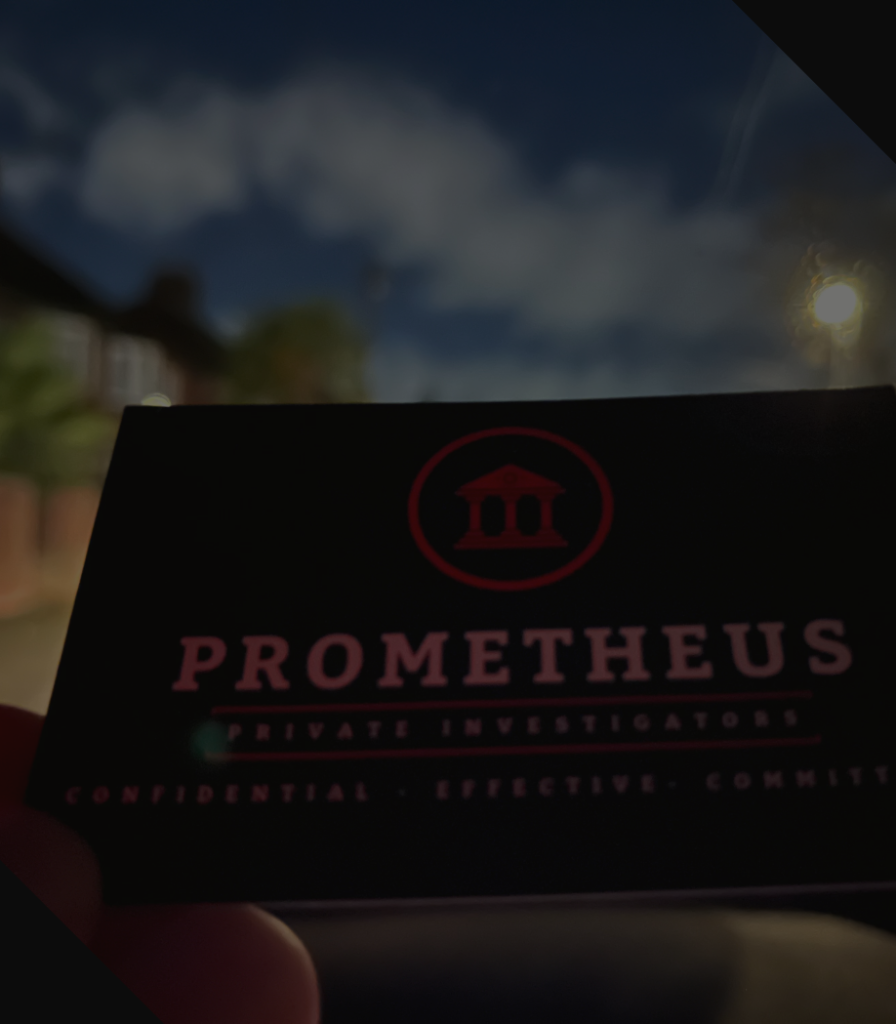 Nottingham private investigator holding Prometheus Investigations business card